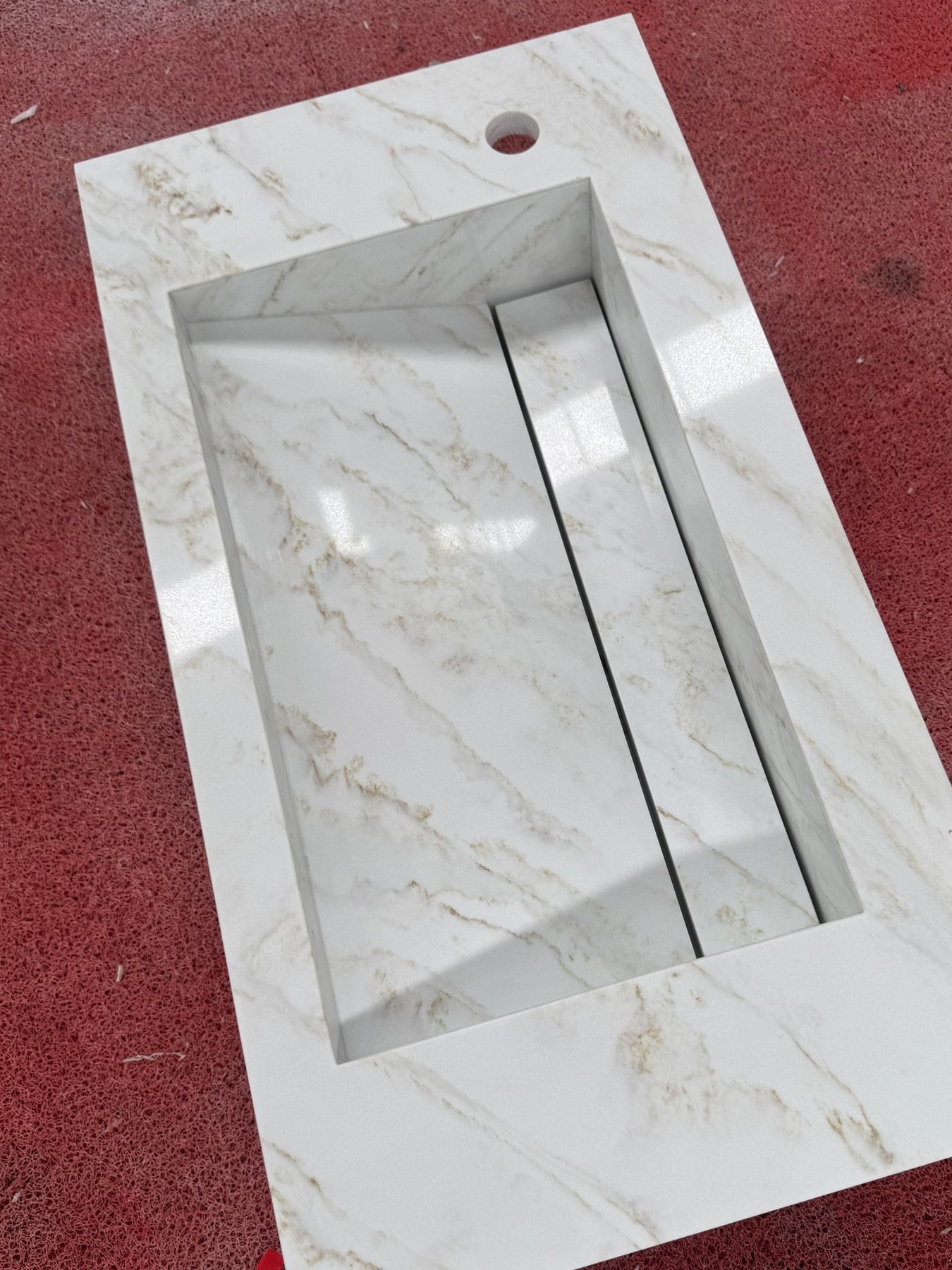 Integrated Sink Vanity Tops for Two Homes — One in Canada, One in Australia Overhead view of a glass stone vanity top showing the integrated sink and linear slot drain